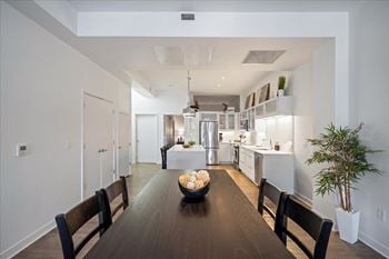Short-term rental kitchen and dining space at sky on main